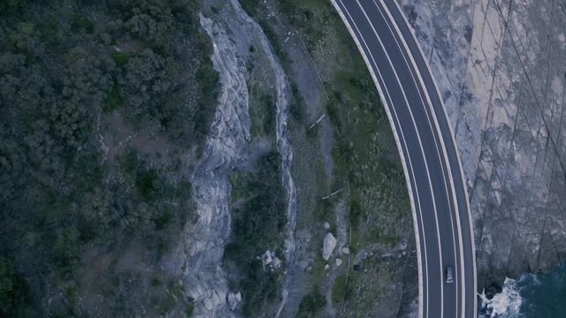 Drone tracking car on Seacliff Bridge, Coalcliff, NSW, Australia - Drone video of the Seacliff bridge near Coalcliff, New South Wales, Sydney, Australia on a spring day