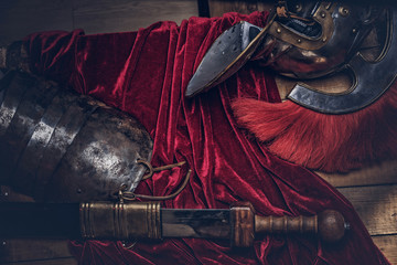 Complete combat equipment of the ancient Greek warrior on a wooden boards.