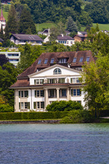 Fototapeta na wymiar Town Verkehrshaus on Lucerne lake