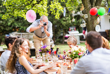 Family celebration or a garden party outside in the backyard.