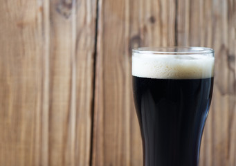glass of dark beer with copyspace