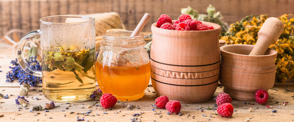 Collection of medicinal herbs Wild herbs Treatment Wooden background Vintage Rural Style, raspberry, honey