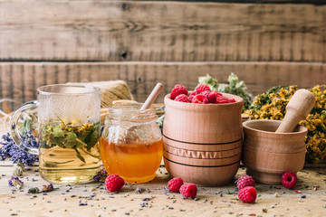 Collection of medicinal herbs Wild herbs Treatment Wooden background Vintage Rural Style, raspberry, honey