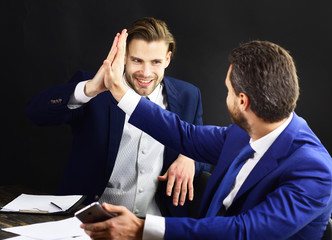 People in formal suits start partnership.