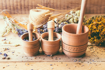 Gathering of Medicinal Wild Herbs Treatment Wooden Background Vintage Rural Country Style, mortar