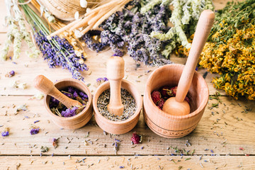 Gathering of Medicinal Wild Herbs Treatment Wooden Background Vintage Rural Country Style, mortar