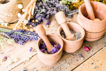 Gathering of Medicinal Wild Herbs Treatment Wooden Background Vintage Rural Country Style, mortar