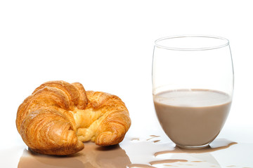 Chocolate milk with croissant isolated on white background