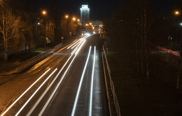 Fototapeta na wymiar Night city. Light marks on the highway. Blurred motion.