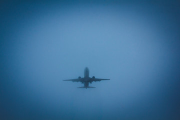 Fototapeta na wymiar The plane flies in the sky. Aircraft on blue sky background