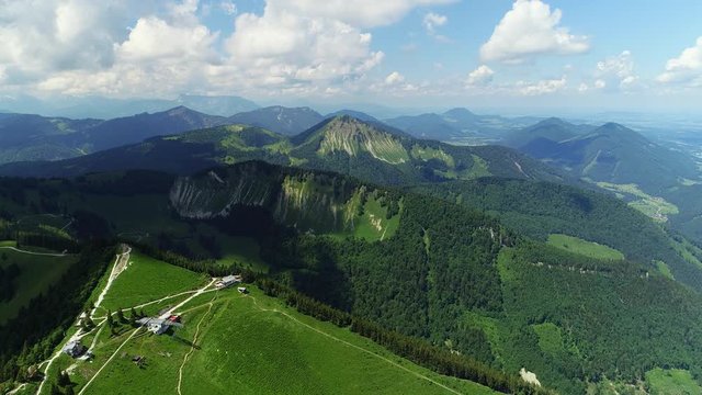 Aerial panoramic view of Austrian Alps near Salzburg in summer, beautiful scenery with majestic lush green slopes and peaks of mountains - picturesque landscape of Austria from above, Europe 