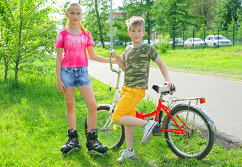 Adolescents are engaged in active sports in the summer park