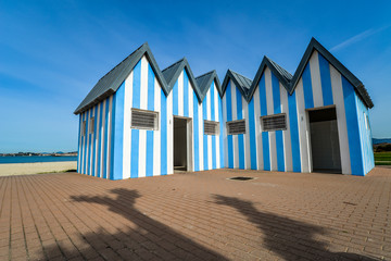 Colourful toilets at the beach