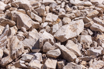 Rocks, small rocks or gravel Used for construction of buildings, roads and for landscaping