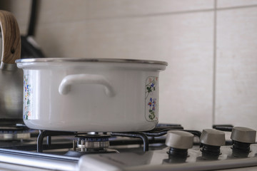pot stands on a gas stove