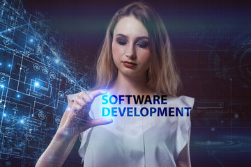 The concept of business, technology, the Internet and the network. A young entrepreneur working on a virtual screen of the future and sees the inscription: Software development