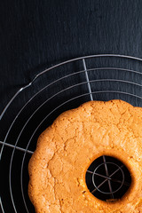 Food Concept Homemade Golden pound cake on bakery rack with black slate board back ground