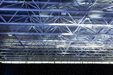 Interior of empty warehouse ceiling with led spot light installed. Preparing for event