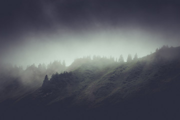Dark moody rainy mountain landscape
