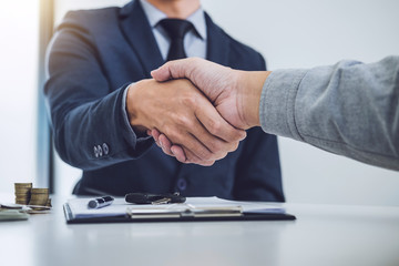 Handshake of cooperation customer and salesman after agreement, successful car loan contract buying or selling new vehicle - obrazy, fototapety, plakaty