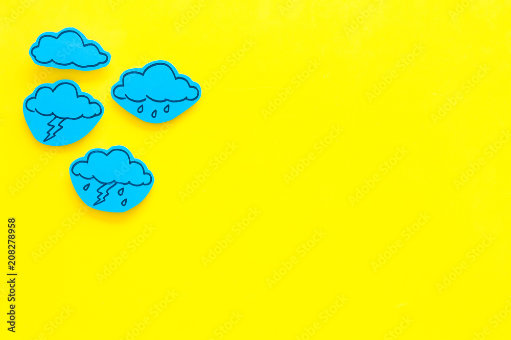 Wall mural modern weather icons set on yellow background top view copy space