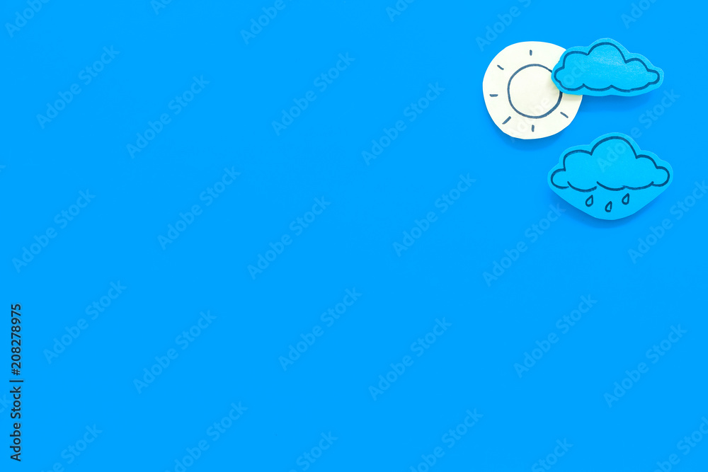 Canvas Prints clear and cloudly weather icons on blue background top view copy space
