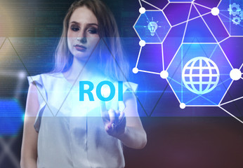 The concept of business, technology, the Internet and the network. A young entrepreneur working on a virtual screen of the future and sees the inscription: ROI