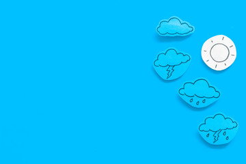 Modern weather icons set on blue background top view copy space