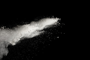 Bizarre forms of  white powder explosion cloud against dark background. Launched white particle splash on black background.
