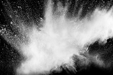 Bizarre forms of  white powder explosion against dark background. Launched white particle splashing.