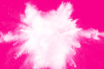 White powder explosion  on pink background.