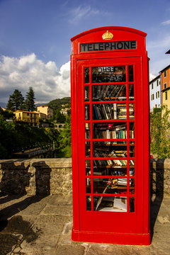 British telephon box full of books in Barga, Italy