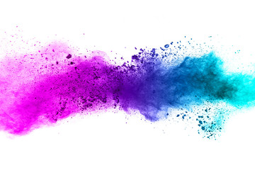 abstract blue-pink dust explosion on  white background. abstract blue-pink powder splattered on white  background, Freeze motion of blue-pink powder exploding.