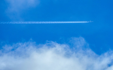 blue cloudy with sky vapour trails
