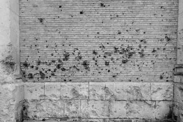 old brick wall with bullet holes near Dunkirk France