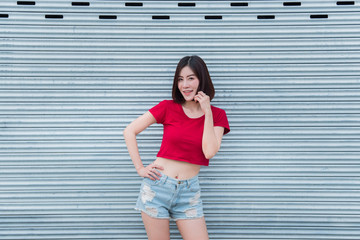 Obraz premium Portrait of asian woman sit on the road,Beautiful thailand people,Happy woman concept,Lifestyle of modern girl
