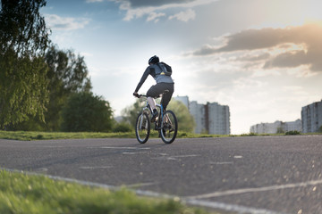 Cyclist riding a bike on an open road