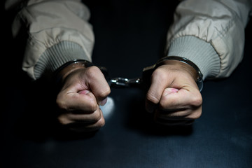 Fototapeta premium The suspect was arrested at the investigation, interview to find out the truth, the thief was caught by the police come to the dark room,Thailand people