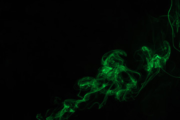 abstract black background with green mystical smoke