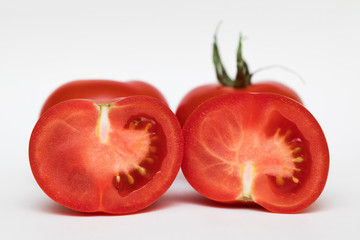 fresh tomatoes close-up on a white background