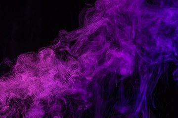 mystical purple smoke on black background