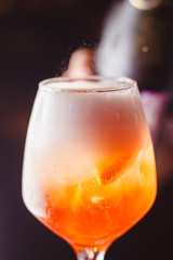 A glass of fresh Aperol Spritz closeup
