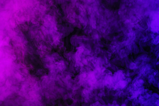 purple smoke on abstract black background