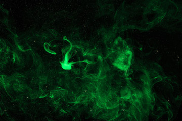 mystical background with green smoke on black © LIGHTFIELD STUDIOS