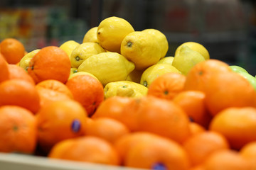Fresh lemons on the supermarket counter
