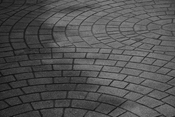 patterned paving tiles, old cement brick floor - monochrome background