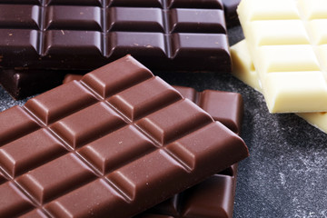 chocolate in diffrent color. milk, dark and white chocolate bars