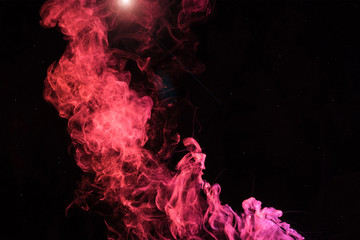 pink spiritual smoky swirl with light on black background