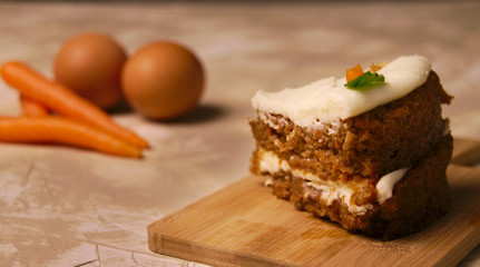 Close-up carrot cake over wood board