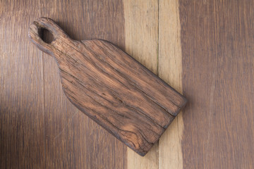 old chopping board on wooden table